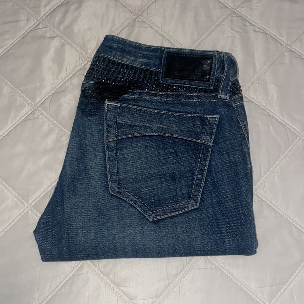 Robins Jean straight leg. Size 27. Med denim with black studs on backside